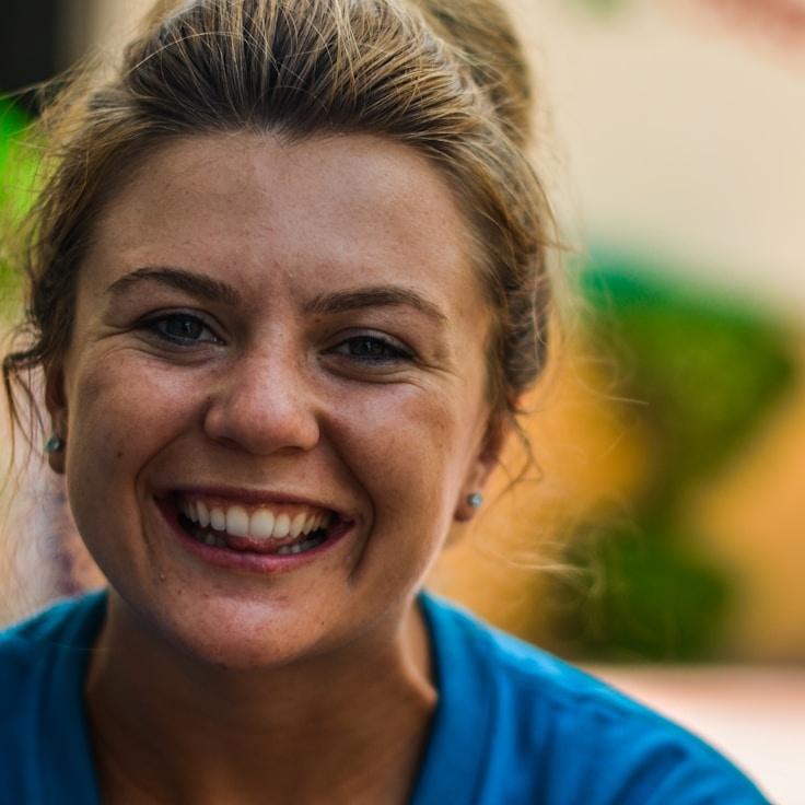 Alex Kim, Lead Design Curator at CopperRippleVale, reviewing corporate floral arrangements